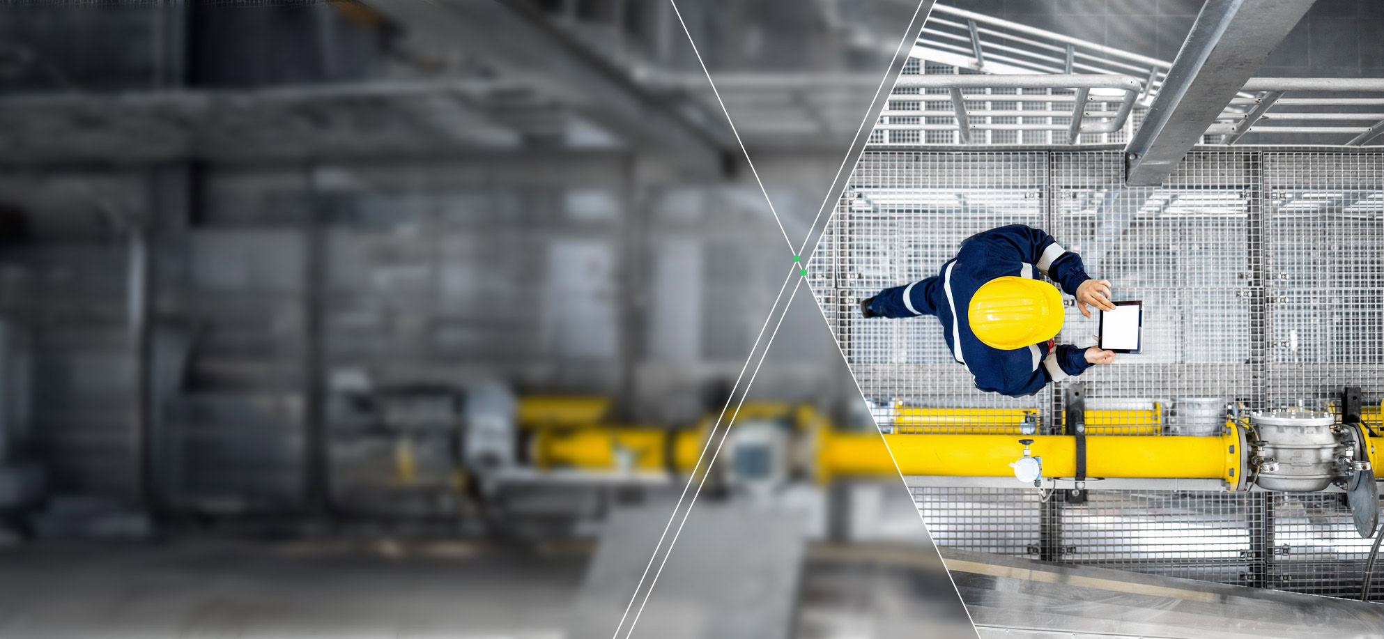 Worker in safety gear holding a tablet, promoting health and safety, stands on an industrial platform above yellow pipes, viewed from above.