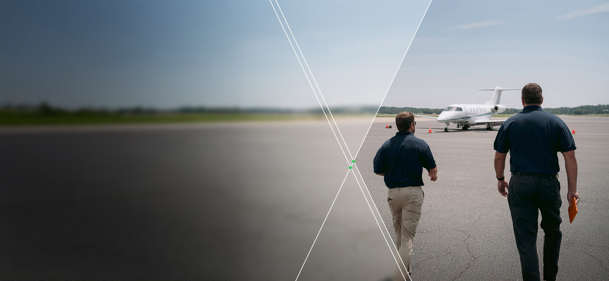 Two men in navy shirts walk across an airport tarmac, reflecting Our Approach as they head toward a small white jet in the distance.