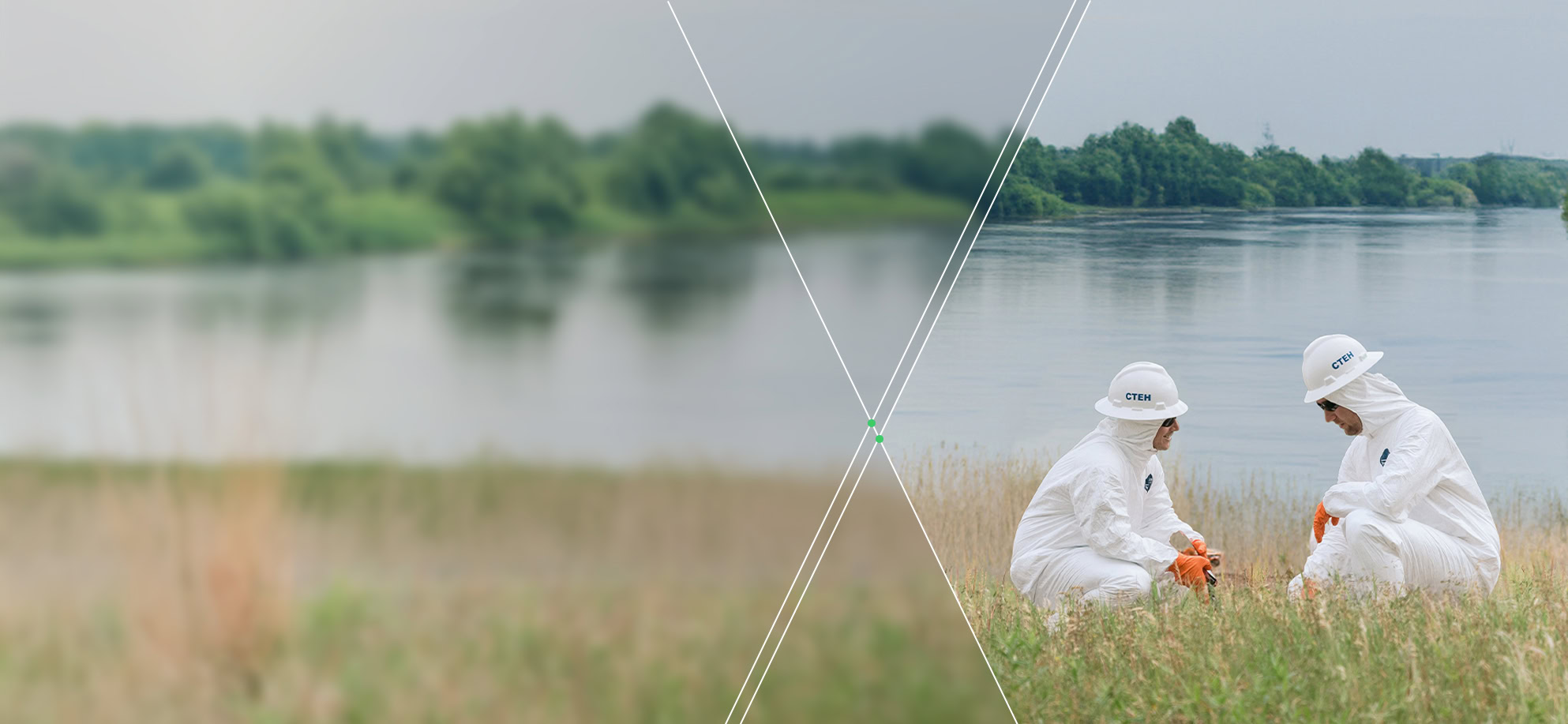 Two people in white protective suits and helmets examine something in grass, likely conducting environmental services near a river and trees.