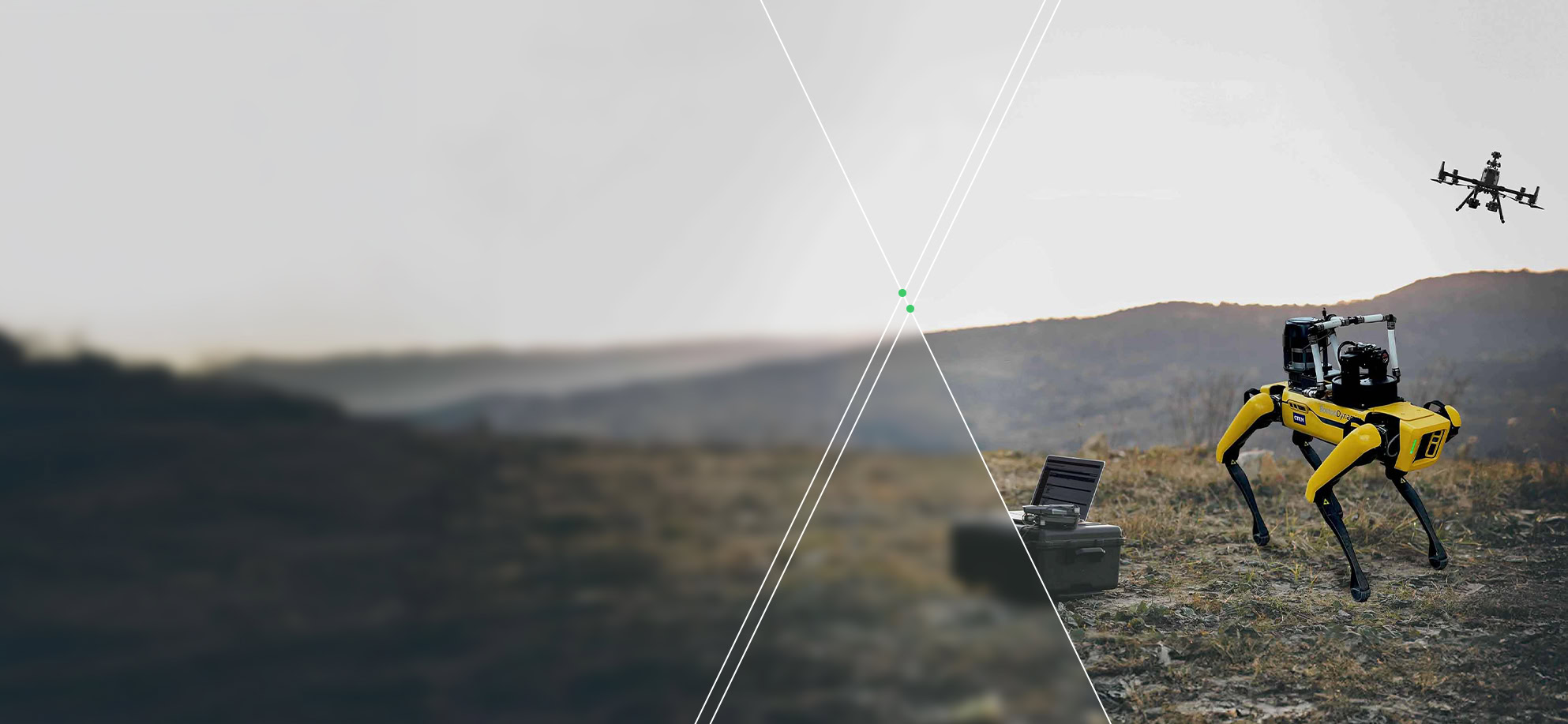 A yellow quadruped robot showcases advanced technology on rough terrain, with a drone flying above a hilly landscape near a black case.
