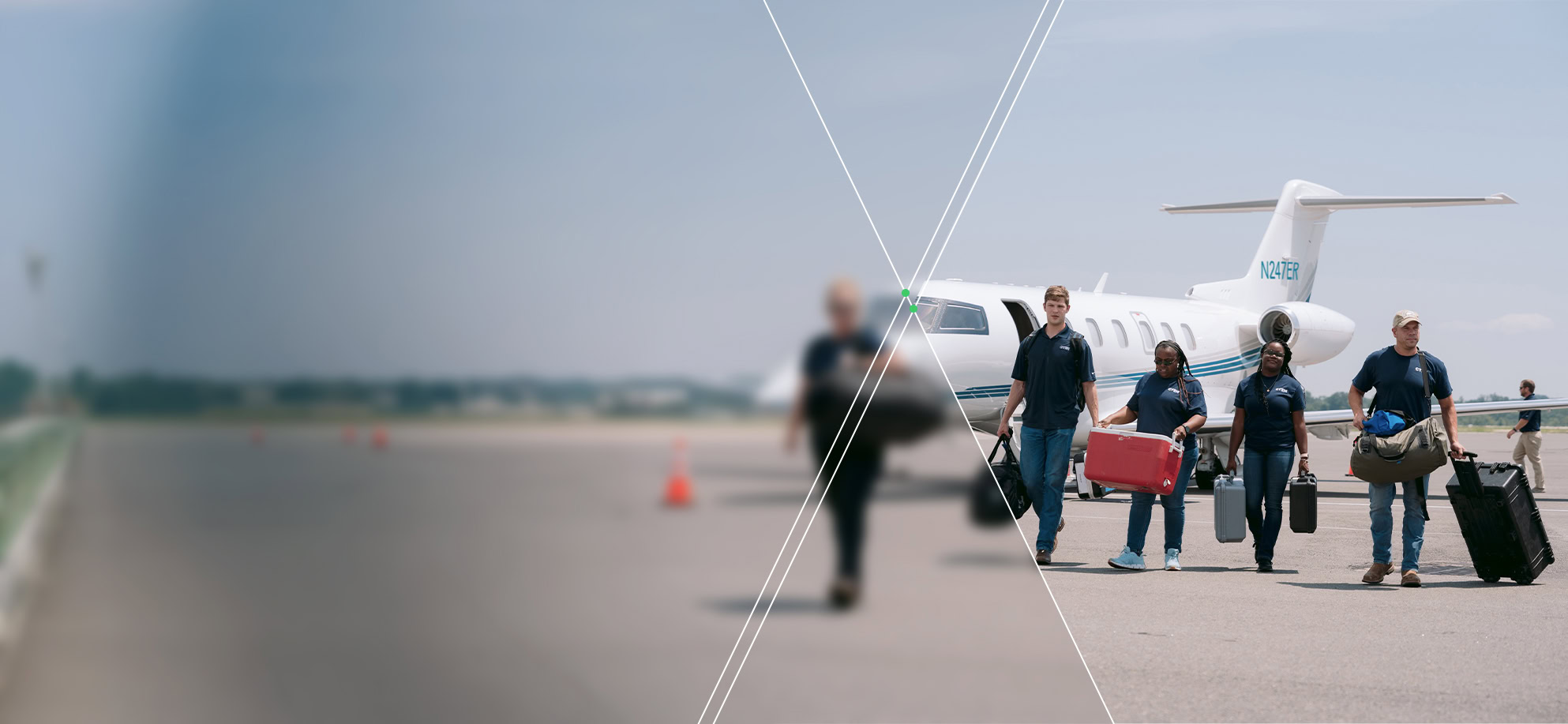 Four people carrying luggage walk away from a small private jet on an airport tarmac; the left side of the image is blurred.